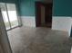 Spacious dining area with tiled floor, white wainscoting, and a sliding glass door at 7406 Nolton Way, Orlando, FL 32822