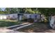 Charming single-story home with gray siding, brick accents and modest landscaping at 7406 Nolton Way, Orlando, FL 32822