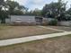 Charming single-story home with gray siding and a well-maintained front yard at 7406 Nolton Way, Orlando, FL 32822
