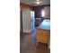 Kitchen featuring tile floors, appliances, and lighting at 7406 Nolton Way, Orlando, FL 32822