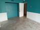 Room featuring blue walls and white wainscoting, offering potential for personalization at 7406 Nolton Way, Orlando, FL 32822