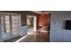 Inviting living room featuring paneled walls and open access to other rooms at 7406 Nolton Way, Orlando, FL 32822