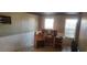Spacious living room featuring an old desk area with windows and natural light at 7406 Nolton Way, Orlando, FL 32822