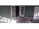 A porch area with doors and potential access to an interior space at 7406 Nolton Way, Orlando, FL 32822