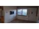 Room featuring paneling and a window at 7406 Nolton Way, Orlando, FL 32822