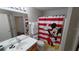 A clean bathroom featuring a shower-tub combination and a sink with a vanity at 8457 Secret Key Cove, Kissimmee, FL 34747