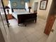 Spacious bedroom with tile flooring, ensuite bathroom, walk-in closet, and comfortable furnishings at 8457 Secret Key Cove, Kissimmee, FL 34747