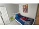 Bright bedroom with a single bed and Marvel-themed decor and fun decorations at 8457 Secret Key Cove, Kissimmee, FL 34747