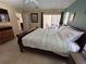 Bedroom with a large bed, TV, and a sliding glass door that opens to a patio at 8457 Secret Key Cove, Kissimmee, FL 34747