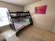 Bedroom featuring a bunk bed and Trolls artwork at 8457 Secret Key Cove, Kissimmee, FL 34747