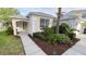 Charming single-story home featuring a manicured lawn and a welcoming front entrance at 8457 Secret Key Cove, Kissimmee, FL 34747