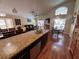 Open-concept kitchen featuring granite countertops, a breakfast bar, and modern stainless steel appliances at 8457 Secret Key Cove, Kissimmee, FL 34747