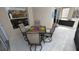 A cozy outdoor seating area with a table for four is perfect for enjoying outdoor meals at 8457 Secret Key Cove, Kissimmee, FL 34747
