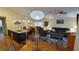 Spacious living area featuring a granite island kitchen, dining area, and comfortable seating at 8457 Secret Key Cove, Kissimmee, FL 34747