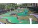 Scenic community mini golf course with manicured landscaping offers a fun and engaging outdoor activity at 8457 Secret Key Cove, Kissimmee, FL 34747
