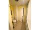 Bathroom featuring a toilet, linen closet, vanity and an entrance doorway at 102 Tangelo Cv, Leesburg, FL 34748