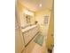 Bright bathroom featuring a white vanity with lots of drawer space and tile floors at 102 Tangelo Cv, Leesburg, FL 34748