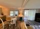 The dining area is well-lit, with sliding door access to the lanai at 102 Tangelo Cv, Leesburg, FL 34748