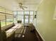 Sunlit Florida room featuring large windows and an open, airy feel at 102 Tangelo Cv, Leesburg, FL 34748