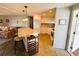 This efficient kitchen has white cabinets, an island, and stainless appliances at 102 Tangelo Cv, Leesburg, FL 34748