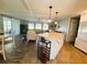 A spacious kitchen island is perfect for dining with great room views at 102 Tangelo Cv, Leesburg, FL 34748