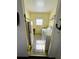 Functional laundry room featuring washer, dryer, and ample storage shelves at 102 Tangelo Cv, Leesburg, FL 34748