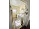 Practical laundry area with washer, dryer, and storage; organized and bright at 102 Tangelo Cv, Leesburg, FL 34748