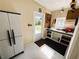 Organized utility room with workbench, storage, and exterior access at 102 Tangelo Cv, Leesburg, FL 34748