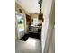 Multi-purpose utility room with a workbench and an exterior door at 102 Tangelo Cv, Leesburg, FL 34748