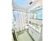 Cozy bathroom features a bathtub with a shower, vanity with a marble countertop, and green accents at 10529 Se 50Th Ave, Belleview, FL 34420