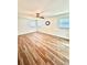 Serene bedroom with modern flooring, ceiling fan, and ample natural light at 10529 Se 50Th Ave, Belleview, FL 34420
