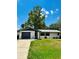 Charming single-story home with a well-maintained front lawn, mature tree and attached garage at 10529 Se 50Th Ave, Belleview, FL 34420