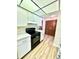 Well-lit kitchen with white cabinetry, modern appliances, and sleek countertops at 10529 Se 50Th Ave, Belleview, FL 34420
