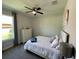 This cozy bedroom features a double bed, dresser, and gray curtains at 10640 Vista Del Sol Cir, Clermont, FL 34711