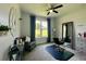 This stylish room showcases a hair-salon setup, large clock and big windows at 10640 Vista Del Sol Cir, Clermont, FL 34711