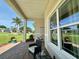 Cozy front porch with comfortable seating and views of the surrounding neighborhood at 10640 Vista Del Sol Cir, Clermont, FL 34711
