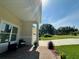 Charming front porch with brick walkway and ample space for outdoor seating at 10640 Vista Del Sol Cir, Clermont, FL 34711