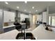 Modern kitchen with white and gray cabinets, stainless steel appliances, and a bright, airy atmosphere at 10640 Vista Del Sol Cir, Clermont, FL 34711