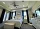 Bright main bedroom with neutral decor, tray ceiling, and ample natural light at 10640 Vista Del Sol Cir, Clermont, FL 34711