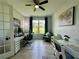 Well-lit office space with a large window and multiple workstations at 10640 Vista Del Sol Cir, Clermont, FL 34711