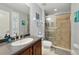 Bathroom featuring a glass enclosed shower and a cherry vanity at 1085 Harmony Ln, Clermont, FL 34711