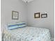 Guest bedroom with beachy decor and plenty of light at 1085 Harmony Ln, Clermont, FL 34711
