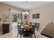 Eat-in kitchen with tile flooring and sliding doors opening to patio at 1085 Harmony Ln, Clermont, FL 34711
