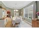 Formal dining room with large window, hutch, and elegant chandelier at 1085 Harmony Ln, Clermont, FL 34711