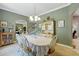 Bright dining area with chandelier and convenient access to other living areas at 1085 Harmony Ln, Clermont, FL 34711