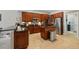 Spacious kitchen featuring granite countertops, stainless steel appliances, and a central island at 1085 Harmony Ln, Clermont, FL 34711