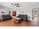 Spacious living room featuring hardwood floors and easy access to kitchen at 1085 Harmony Ln, Clermont, FL 34711