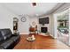 Well lit living area with fireplace, and access to outdoor living area at 1085 Harmony Ln, Clermont, FL 34711
