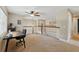 Second floor loft with ceiling fan, neutral tones, and view of the home's railing at 1085 Harmony Ln, Clermont, FL 34711