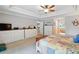 Bright main bedroom with white dressers, tray ceiling and patchwork quilt bedding at 1085 Harmony Ln, Clermont, FL 34711